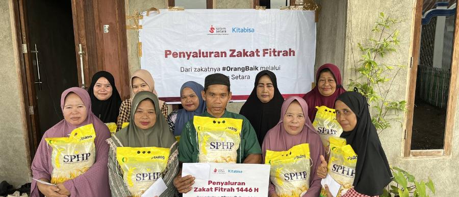 Penyaluran zakat fitrah kepada warga penerima manfaat